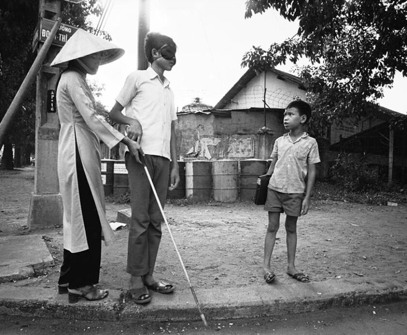 Saigon 1972 - People who have turned blind because of the war learn to cross a road.